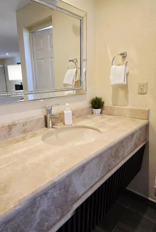 Guest bathroom at Hotel Express Inn